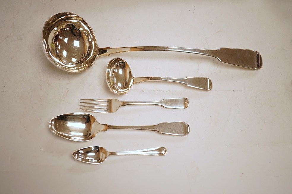 A 19th century matched part canteen of 19th century silver fiddle pattern flatware including a soup ladle and a sauce ladle, twelve table spoons, eight table forks, eight dessert forks, eight dessert spoons and six teasp